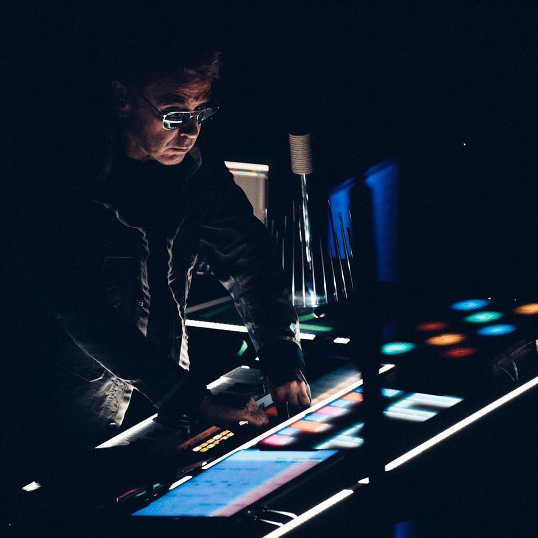 Jean-Michel Jarre at a lit console